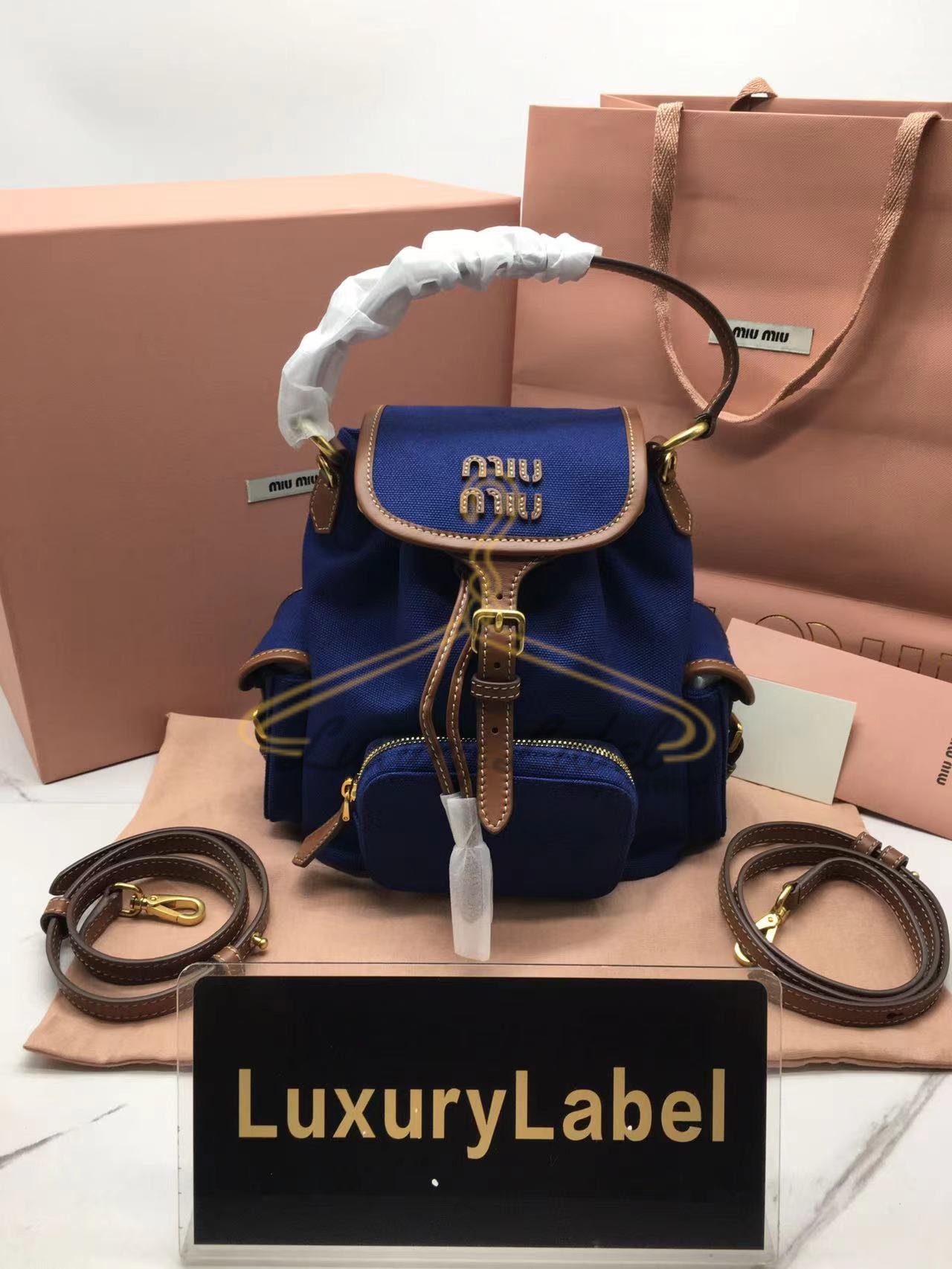 미우미우 엠보싱로고 캔버스 및 가죽 백팩 스몰, 미디움